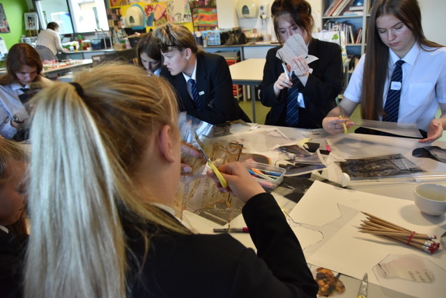 teens around a table cutting and curating acetate roses