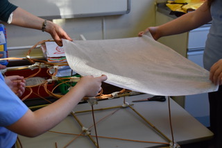 gluing a paper lantern