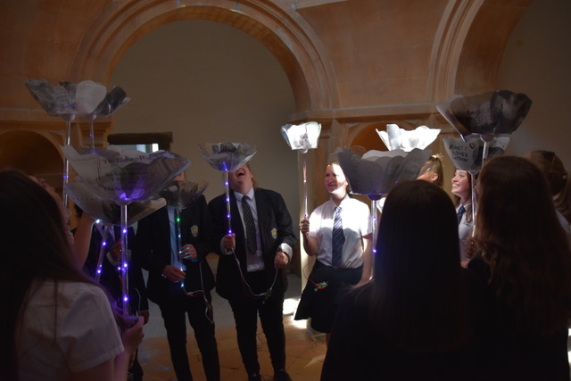 group of girls holding digital rose projects inside Bolsover Castle