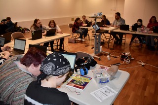 Image showing 20 participants coding on laptops at a workshop to launch Huddersfield Girl Geeks