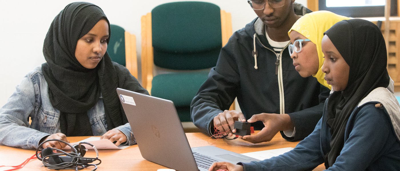 family use laptop at workshop