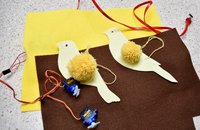 canary birds made out of pom poms and card