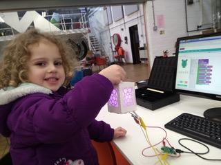 young child holding digital lantern project from manchester jam