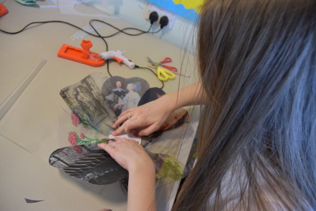 girl glueing acetate rose petals