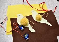 canary birds made out of pom poms and card